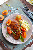 Duck breast roasted in honey marinade with apricots and mashed potato