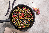 Charred green beans with garlic and pomegranate seeds