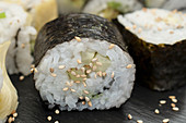 Cucumber and avocado sushi rolled in seaweed and yuba skins