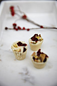 White chocolate confectionery with dried cranberries and pistachios