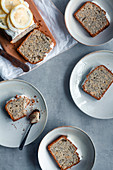Pieces of lemon and poppy seeds cake served on white plates