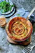 Catherine wheel toad-in-the-hole with honey and mustard onions