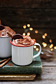 Hot chocolate with cream in an enamel mug