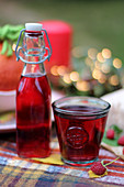 Raspberry juice on an autumnal table