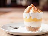 Layer dessert with lemon curd and meringue topping