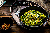 Spaghetti with cabbage, pesto and pistachios