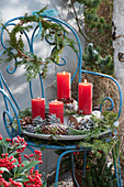 Unusual Advent wreath made of natural materials on a terrace chair