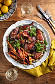 Glazed duck with bacon and carrots