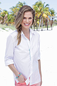 A long-haired woman wearing white shirt