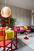 Brightly coloured accents in multifunctional living room