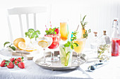 Various sparkling summer cocktails on a tray
