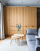Modern wooden cupboards in grey living room