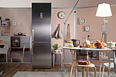 Floor-to-ceiling stainless-steel fridge as decorative furnishing in kitchen