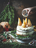 Christmas cake with vanilla frosting and pears