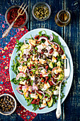 Salad with avocado, dried tomatoes and feta