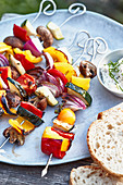 Grilled vegetable kebabs with a herb and quark dip