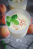 A peach smoothie with saffron and mint