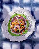 Risotto with black rice, vegetables and basil sauce