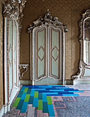 Blue floor in interior of historic building with Baroque doors