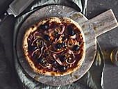 Pizza Napoli with anchovies, olives and onions