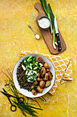Roast potatoes with lentils, spring onions and chive mayonnaise