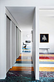 Marble floor made from strips of various colours in designer apartment