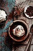 Hot chocolate with whipped cream and cocoa pow