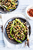 Warm chickpea salad with green asparagus and chilli flakes