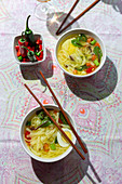 Oriental ramen healthy noodles soup with shiitake, spinach, carrots, eggs and chillies