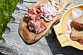 Smoked ham and lardo (fatty, white bacon) on a bread board