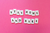 The words 'Stay Home And Bake'