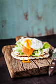Waffle sandwich with salmon and a poached egg