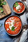 Tomato soup with rice, minced meat and parmesan shavings