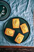 Lemon Turmeric Cakes on green serving plate