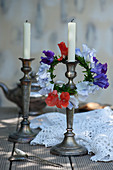 Wreath of sweet peas on silver candlestick