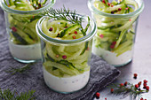 Cucumber spaghetti with pink pepper and dill in a glass