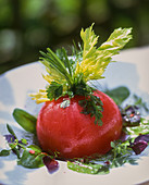 Poached tomato on lettuce