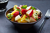 Fruit salad with raspberries and mint