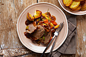Leg of lamb with potatoes and vegetables