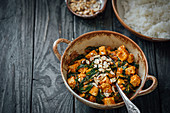 Tofu spinach curry with basmati rice and cashews