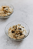 Banana ice cream with grated chocolate and peanuts