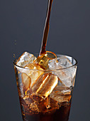 Iced coffee - Pouring coffee on ice cubes