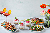 Spring menu consisting of an aperitif, starters, meat dish and dessert in a glass