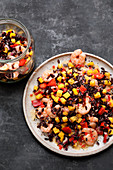 Black rice salad with prawns, peppers and mango
