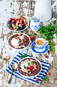 Hot chocolate cakes with berries and ice cream