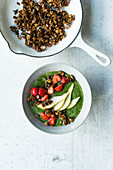 Green smoothie bowl with granola and fruit