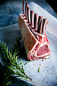Rack of lamb on greeseproof with rosemary pre cook
