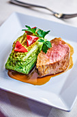 Beef with puree and roasted lettuce