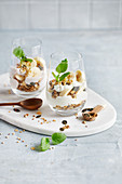 Banana Skyr trifle in a glass on a white marble plate