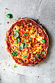 Quick flatbread pizza with tomato sauce and basil